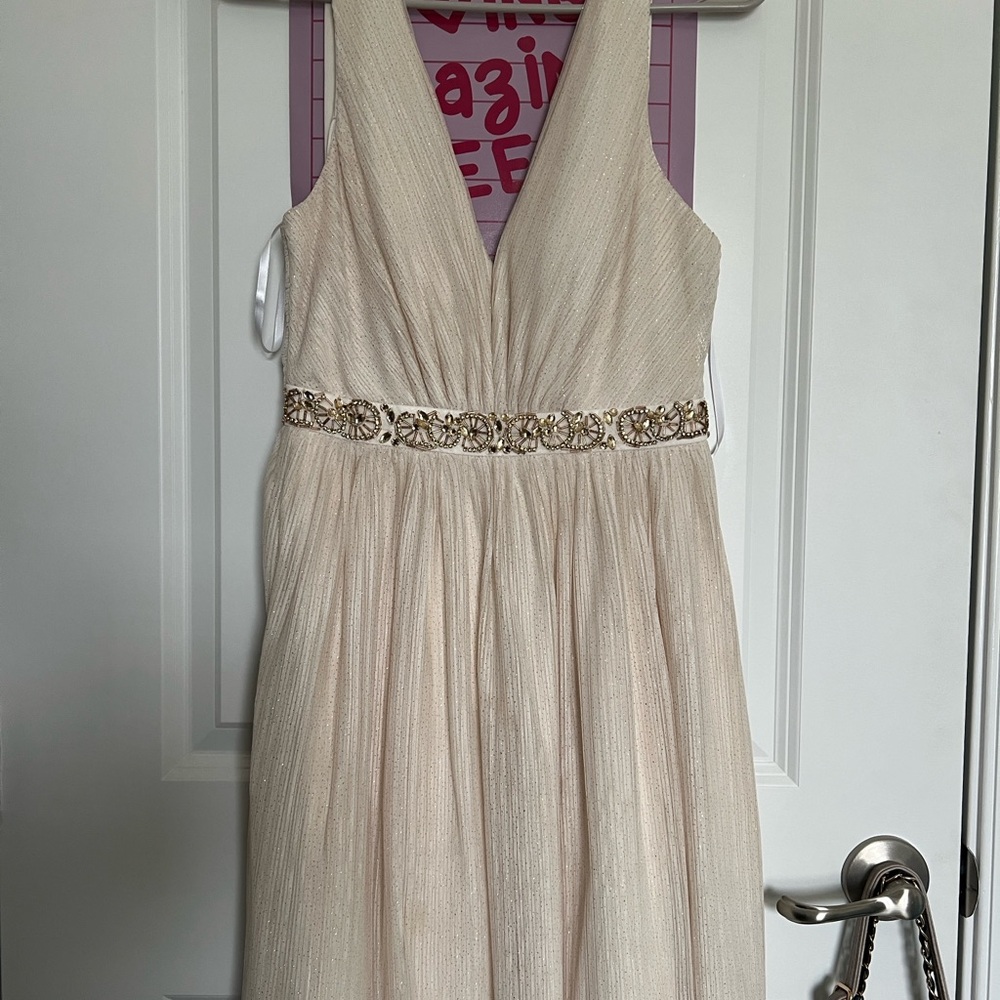 Elegant Cream Sleeveless Dress with Embellished Waist